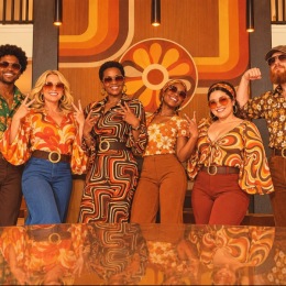 a group of people in 70s style clothing