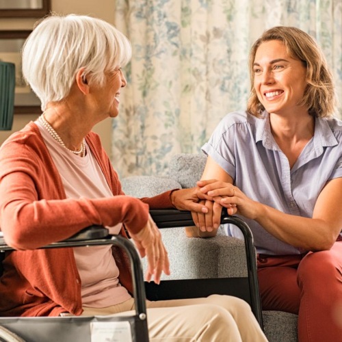 a person sitting on a chair with a person sitting on the chair