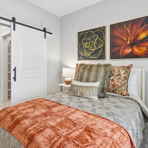 a bedroom with a bed and a table