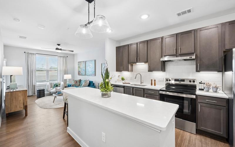 a kitchen with a white counter top