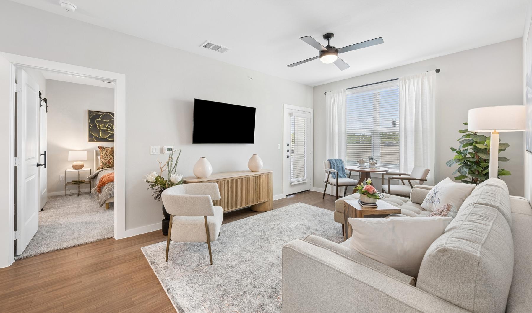 a living room with a tv and furniture
